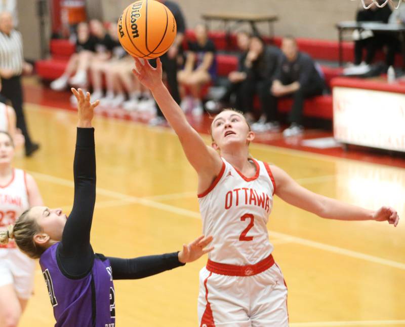 Ottawa's Ashlynn Ganiere intercepts a pass intended for Dixon's Rese Dambman on Wednesday, Dec. 3, 2025 in Kingman Gymnasium at Ottawa High School.