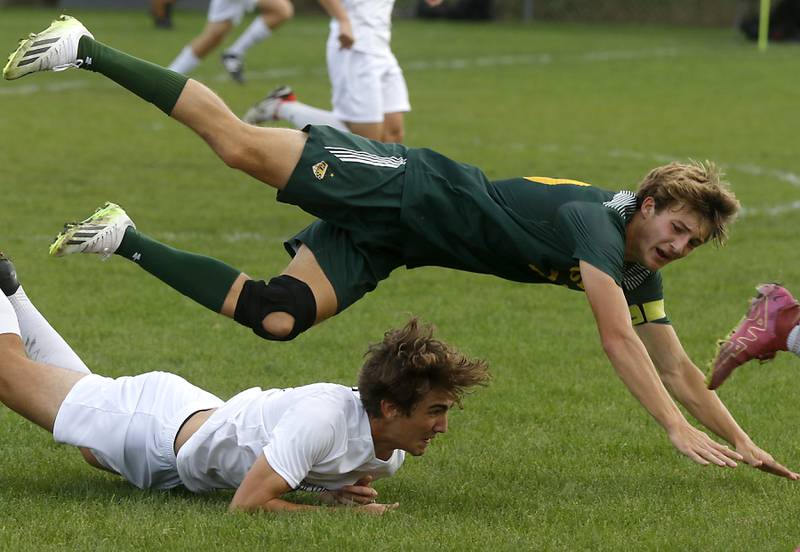 Crystal Lake South's Nolan Getzinger flies over Huntley's Jonas Brown after they collided during a Fox Valley Conference soccer match on Thursday, Sept. 28, 2023, at Crystal Lake South High School.
