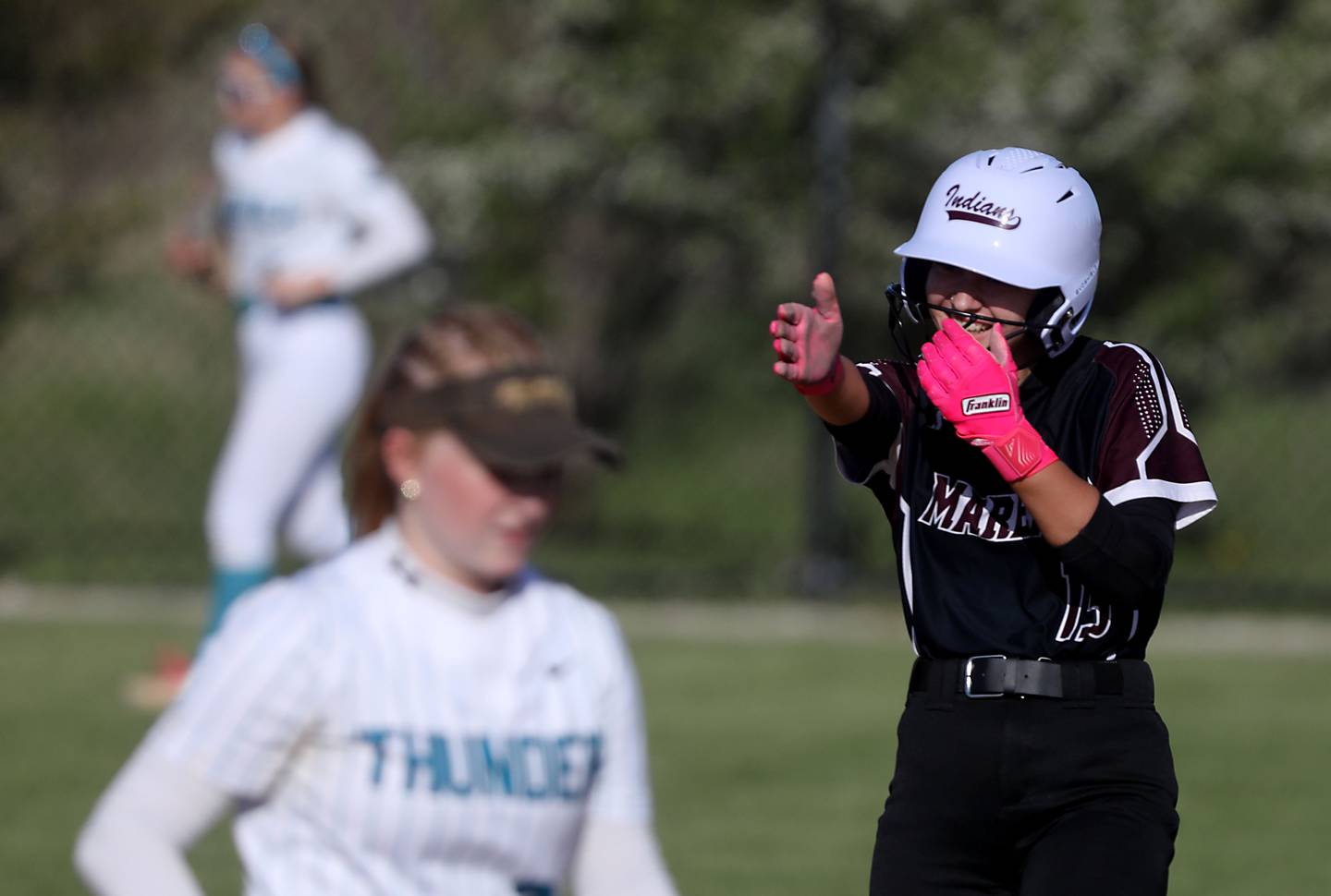 Marengo's Emma Anderson celebrates a double during a Kishwaukee River Conference softball game against Woodstock North on Tuesday, April 28 , 2026, at Woodstock North High School.