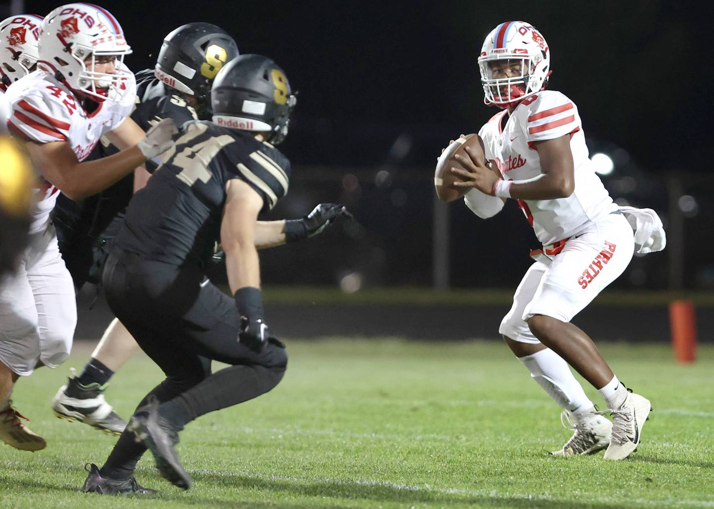 Ottawa's Colby Mortenson looks for a receiver in the Sycamore secondary during their game Friday, Sept. 16, 2022, at Sycamore High School.