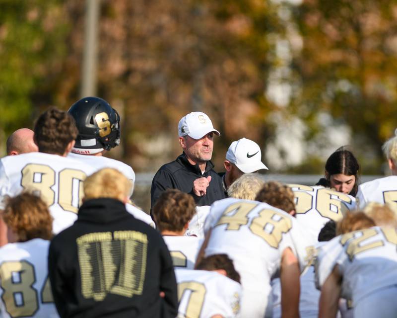 Sycamore’s Coach talks to the team after falling short of a win on Saturday Nov. 4, 2023, as they traveled to Gately Stadium to take on Morgan Park in the second round of football playoffs.