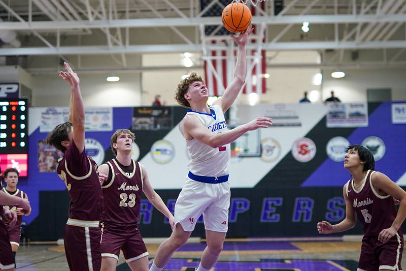 Marmion's Caden Anderson (2) shoots the ball in the paint against Morris during a basketball game in the opening round of the 61st annual Plano Christmas Classic at Plano High School on Monday, December 23, 2024.
