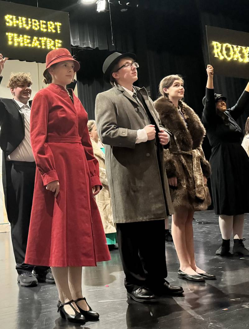 Ava Wagner as Grace, Robert Murphy as Warbucks and Maggie Wiegman as Annie rehearse a scene in Ottawa High School's performance of "Annie."