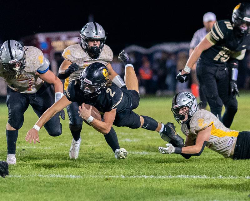 Sycamore's Elijah Meier (2) carries the ball on a keeper against Kaneland during a football game at Kaneland High School in Maple Park on Friday, Sep 30, 2022.