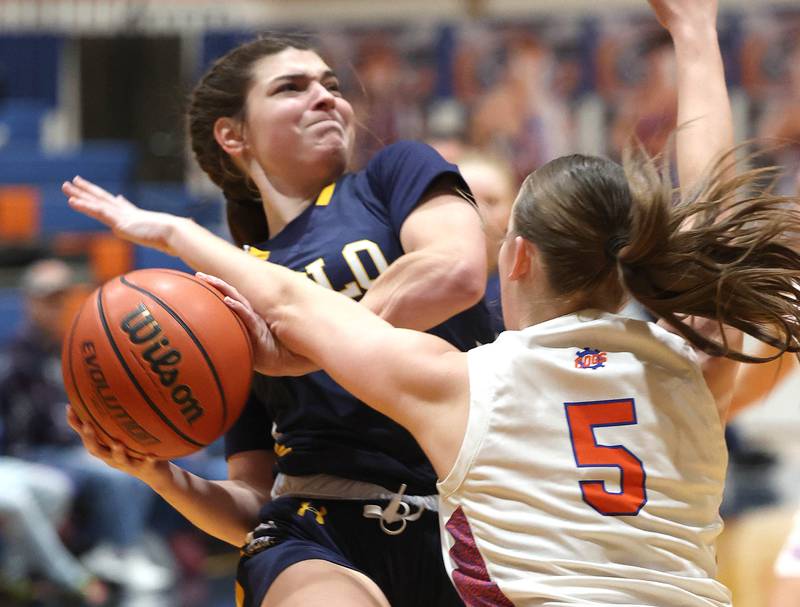 Polo’s Elsa Monoco is fouled by Genoa-Kingston's Zoe Boylen during their game Monday, Jan. 29, 2024, at Genoa-Kingston High School.