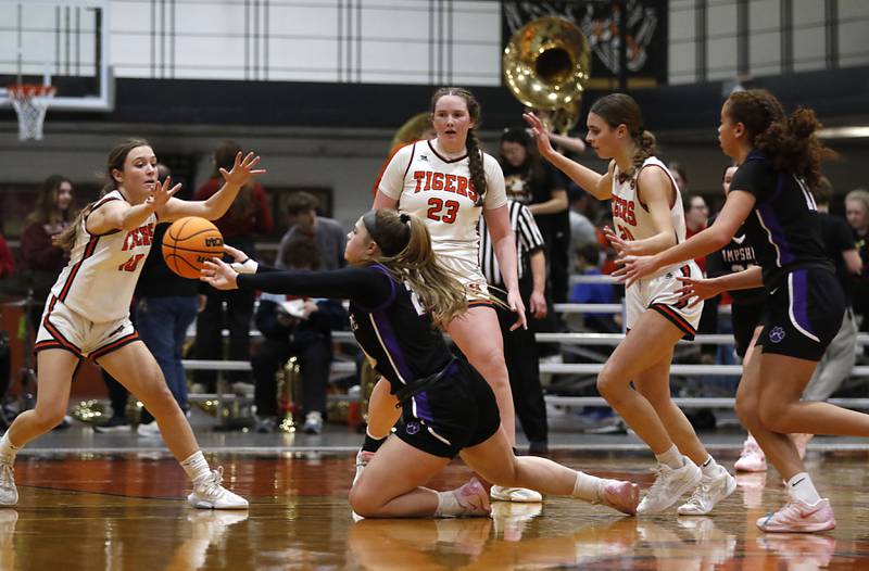 Hampshire's Chloe Van Horn passes the ball as she is triple teamed by Crystal Lake Central's Samantha Pottorff, Leah Spychala, and Crystal Lake Central's Hadley Ferrero during a a Fox Valley Conference basketball game on Friday, Feb. 7, 2025, at Crystal Lake Central High School.