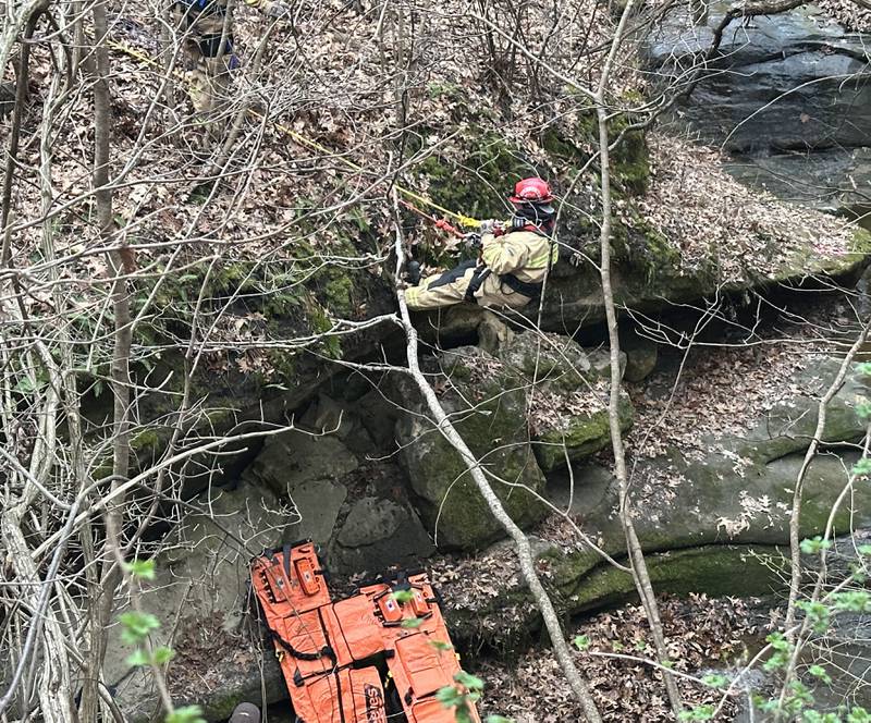 A firefighter rappels into French Canyon for two patients who fell 20-30 feet on Tuesday, April 1, 2025 at Starved Rock State Park. A Mutual Aid Box Alarm System (MABAS) prompted rope and rescuers as far as Marseilles and Princeton.