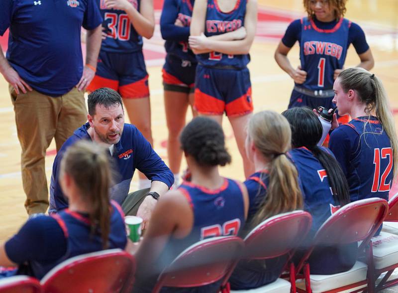 Oswego’s head coach Dave Lay talks to his players during a break in play against Naperville Central during a basketball game at Naperville Central High School on Friday, Nov 17, 2023.