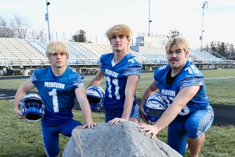 Touching the Bryant Field Rock is part of Princeton Tiger tradition. The trio of Casey Etheridge (from left), Noah LaPorte and Payne Miller all kept the tradition going, leading the Tigers to their sixth straight Three Rivers East division championship and fourth straight quarterfinal appearance.