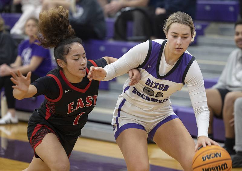 Dixon’s Reese Dambman is fouled by Rockford East’s Nina Herbig Monday, Feb. 16, 2026.
