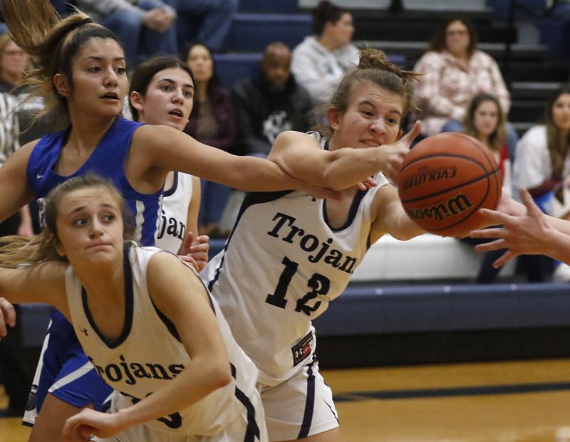 Cary-Grove's Payton Seibert grabs a rebound in front of Burlington Central's Samantha Origel during a Fox Valley Conference girls basketball game Friday Jan. 6, 2023, at Cary-Grove High School in Cary.