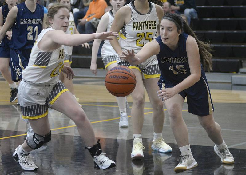 Putnam County’s Gracie Ciucci and Marquette’s Makayla Backos battle for a loose ball in the 2nd period on Wednesday, Dec. 14, 2022 at Putnam County High School.