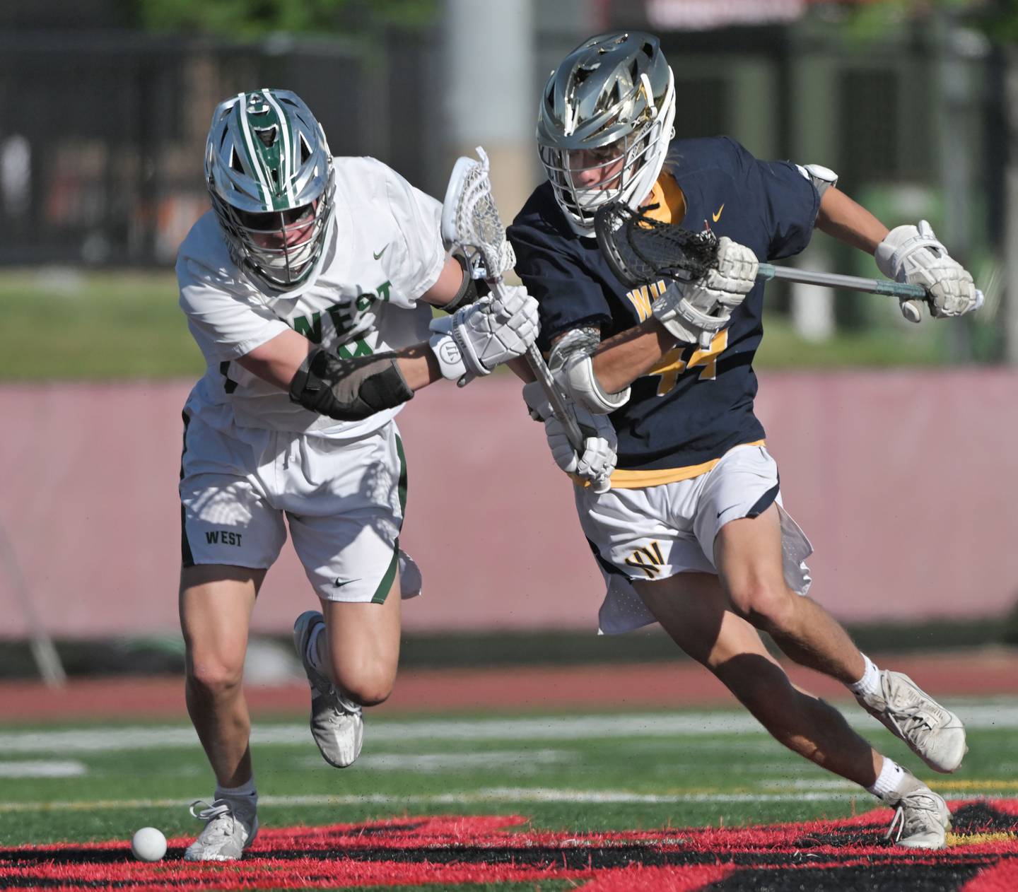 Glenbard West’s Cole Glascott and Neuqua Valley’s Ben Stefanski race to the ball in the boys lacrosse state semifinal game in Hinsdale on Thursday, May 30, 2024.