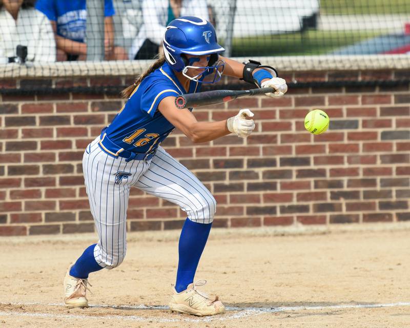 Wheaton North's Abby Del Preto (12) tries to lay down a bunt during the sectional semifinal game against Weaton Warrenville South on Thursday June 5, 2025, held at Oswego High School.
