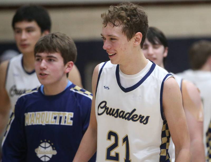 Marquette's Lucas Craig smiles while walking off the floor after defeating Seneca on Friday, Feb. 21, 2025 in Bader Gym at Marquette Academy.