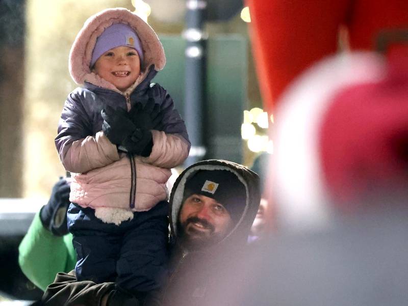 Attendees show their excitement as Santa Claus and Elfie arrive at the Egyptian Theatre Thursday, Dec. 4, 2025, during the annual Lights on Lincoln and Santa Comes to Town event hosted by the DeKalb Chamber of Commerce.