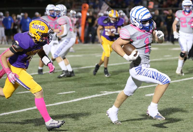 Princeton's Casey Etheridge runs down the sidelines past Mendota's Rhett Watson on Friday, Oct. 11, 2024 at Mendota High School.