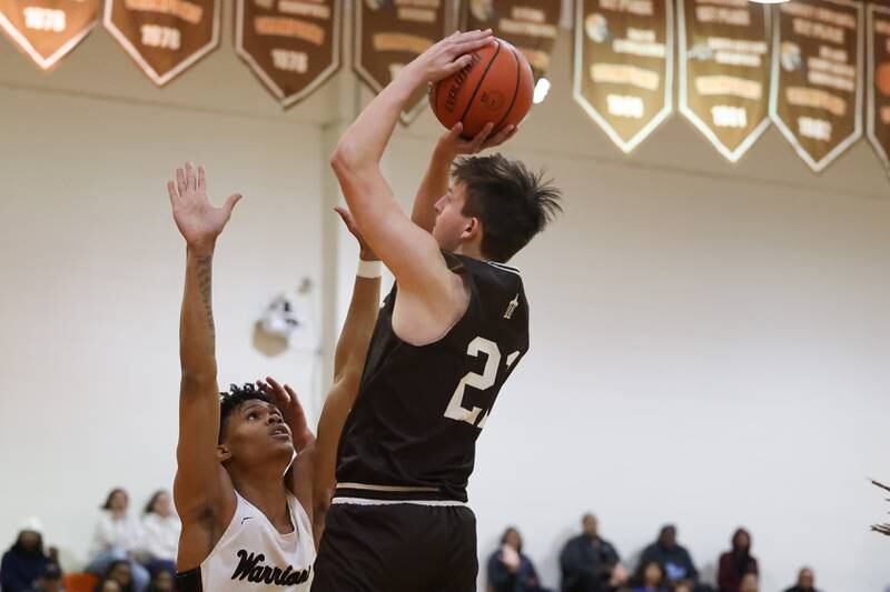 Joliet Catholic’s Owen Wiers puts up a shot against Prespectives in the Class 2A Julian Sectional championship on Friday, March 3rd, 2023 in Chicago.