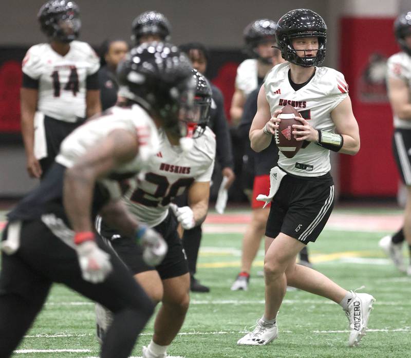 Northern Illinois University quarterback Josh Holst looks for a receiver Tuesday, March 26, 2024, during spring practice in the Chessick Practice Center at NIU.