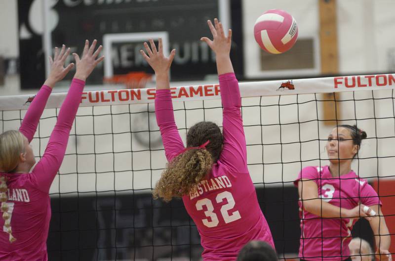 Fulton's Kerby Germann (3) spikes the ball as Eastland's Keara Kaus (32) jumps to block during Tuesday, Oct. 7, 2025 action in Fulton.