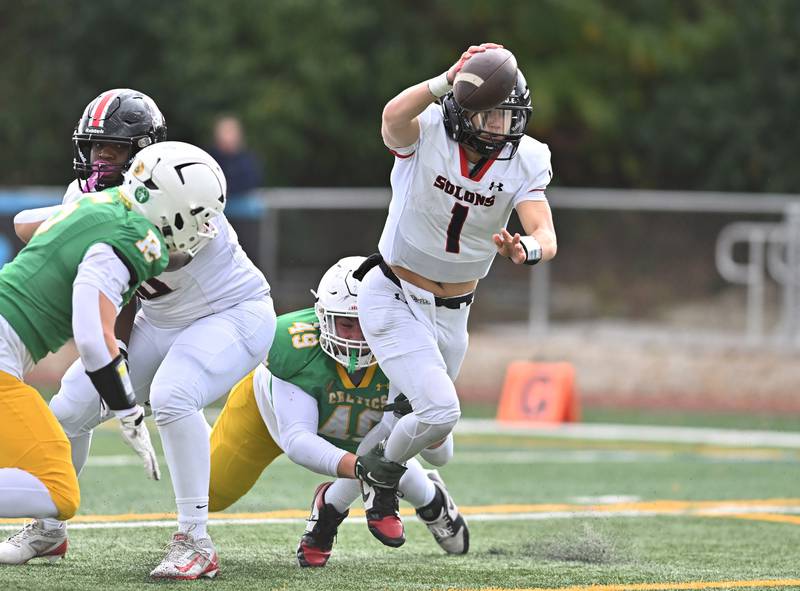 Springfield's Brody Scheffler (1) gets tackle from behind by Providence Catholic's Dom Infelise (49) during the class 5A first round playoff game on Saturday, NOV. 01, 2025, at New Lenox.