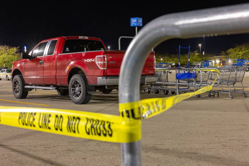Police tape surrounds a suspicious vehicle in the parking lot of the Peru Walmart on Thursday, September 25, 2025 in Peru.
