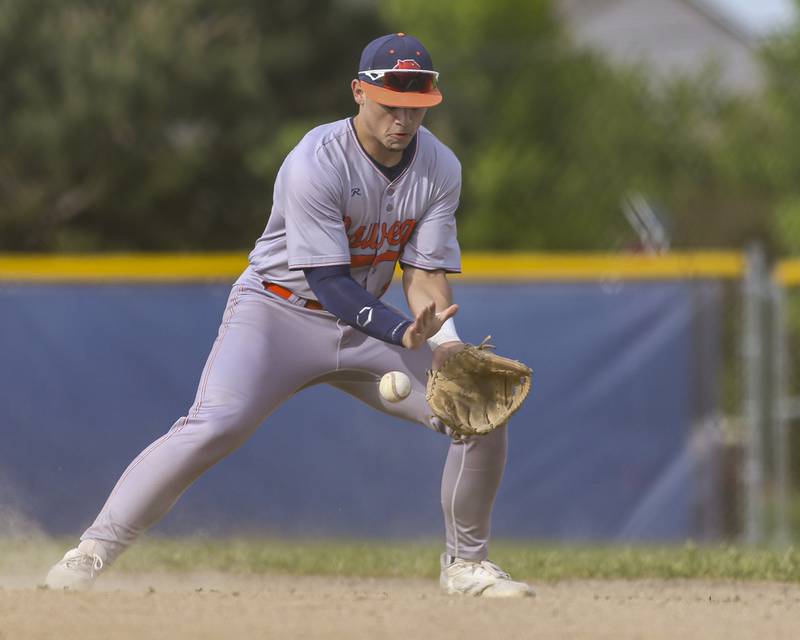 Oswego's Isaiah Logan (11) fields a bouncer to second during baseball game between Oswego East at Oswego. Monday, May 19, 2025 in Oswego.