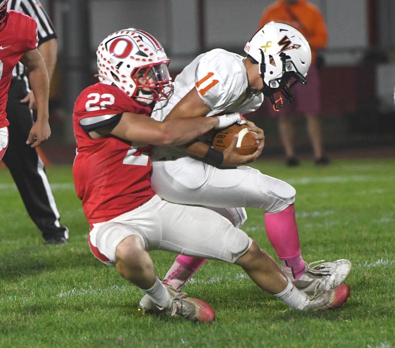 Oregon's Ethan Reed tackles Winnebago's Kaeden Langholf on Friday, Oct. 17, 2025 at Landers-Loomis Field in Oregon.