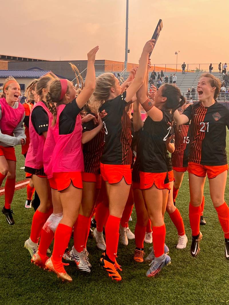 St. Charles East players celebrate after beating Schaumburg 2-1 in the Class 3A Conant Regional final on Friday, May 19.