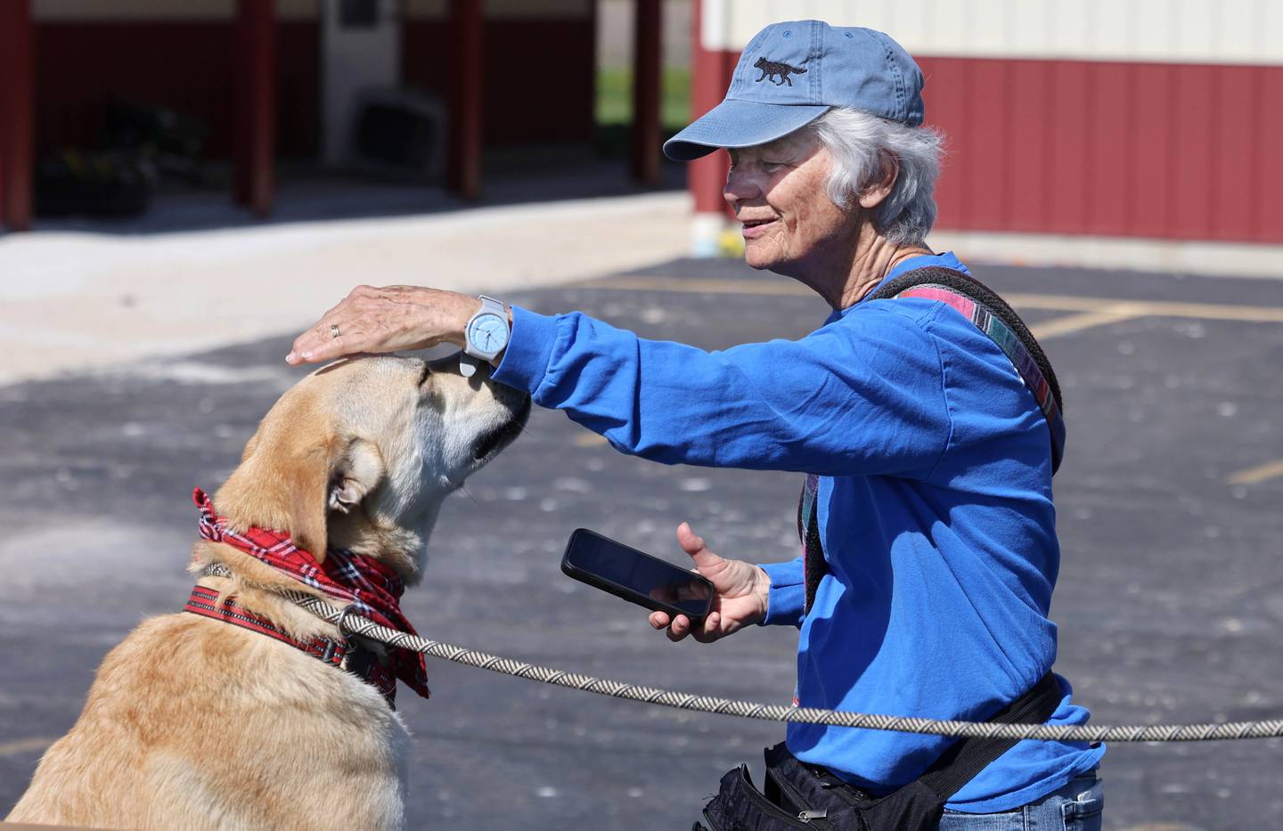 Longtime Tails Humane Society volunteer Nancy Rigler does some training with Butterscotch Thursday, April 23, 2026, at Tails in DeKalb.