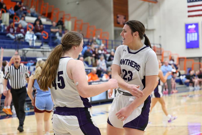 Manteno’s Maddie Gesky, right, high fives teammate Emily Horath as she earned the chance for a three-point play during the Panthers’ 44-23 victory over St. Joseph-Ogden in the IHSA Class 2A Pontiac Sectional semifinal on Tuesday, Feb. 24, 2026, at Pontiac Township High School.