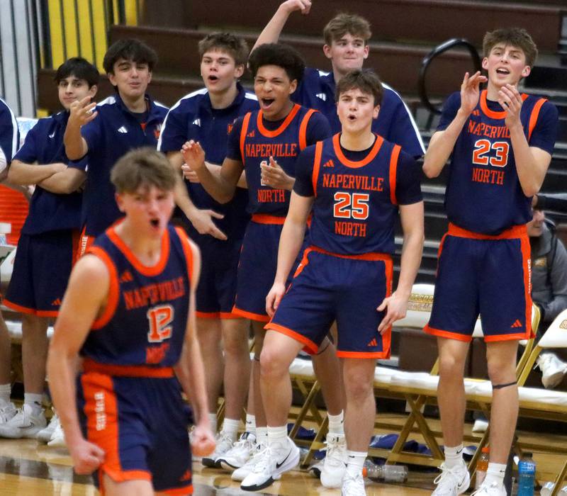 Naperville North’s Huskies get revved up as they build their lead over Cary-Grove in varsity boys basketball Hinkle Holiday Classic action on Monday, Dec. 21, 2025, at Jacobs High School in Algonquin.