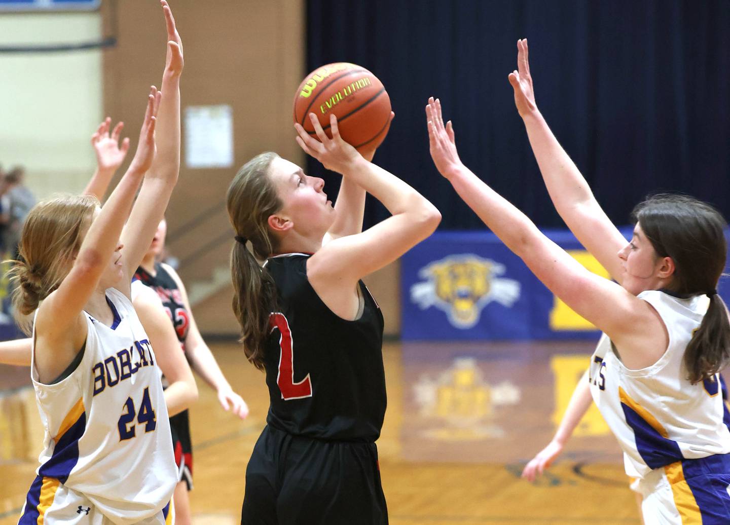 Indian Creek's Bethany Odle gets up a shot between two Somonauk defenders during their game Monday, Jan. 9, 2023, at Somonauk High School.