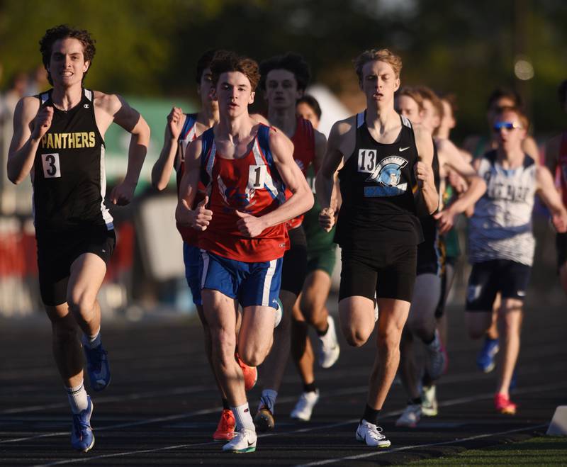 Glenbard North’s Gabriel Early, left, and Glenbard South’s Lucas Galas are at the front of the pack halfway through the 800-meter run during the DuPage County boys track and field meet at Wheaton Warrenville South High School on Friday, May 9, 2025 in Wheaton.