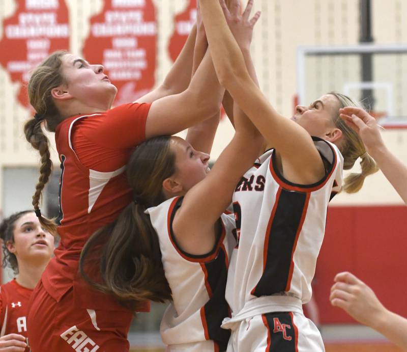 Amboy's Leighton Gulley and Maddie Althaus battle an Aurora Christian player for a rebound at the Oregon Girls Tip-Off Tournament on Wednesday, Nov. 19, 2025 in Oregon.