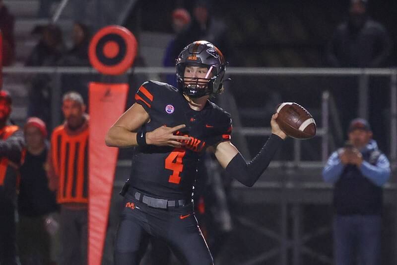 Minooka’s Zane Caves side arms a pass against Lincoln-Way East on Friday, Nov. 8, 2024 in Minooka.