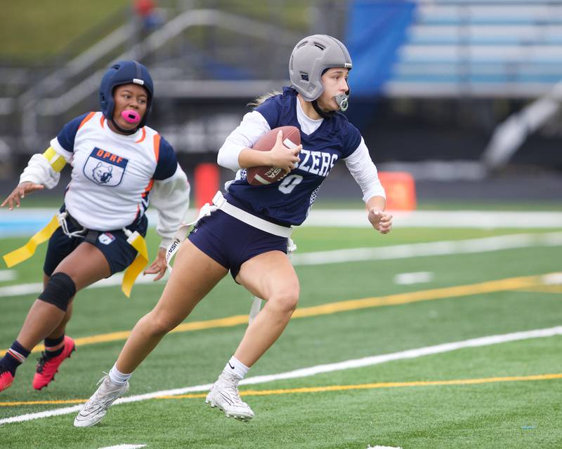 Addison Trails Emma Caniglia runs the ball against Oak Park River Forest on Saturday, September 28,2024 in Villa Park.