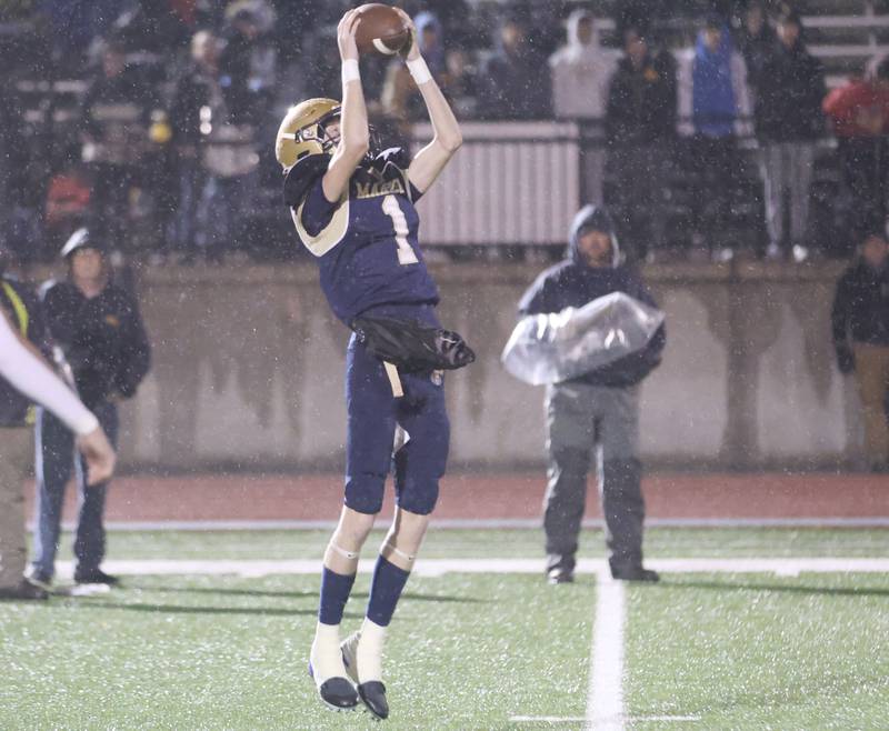 Polo's Jackson Willis, hangs on to make a catch during the 8-man I8FA championship game on Friday, Nov. 21, 2025 at April Zorn Memorial Stadium in Monmouth.