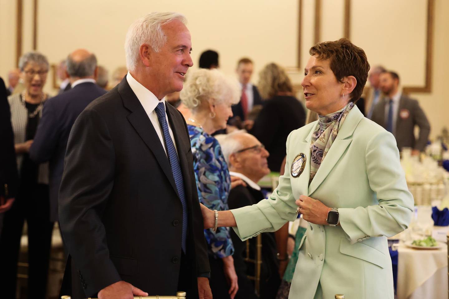 Joliet Mayor Terry D’Arcy and Gloria Dollinger, of the Joliet Rotary Club, converse at a luncheon to celebrate the 110th anniversary of the Rotary Club at Jacob Henry Mansion on Tuesday, Aug. 1 in Joliet.