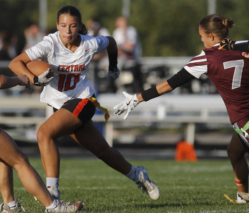 Crystal Lake Central's Brooklyn Johnson runs away from Prairie Ridge’s Lila Stewart during a girls flag football game on Thursday, Sept. 4, 2025, at Prairie Ridge High School in Crystal Lake.