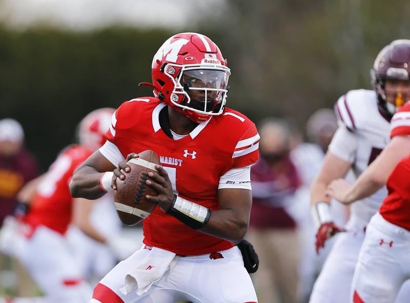 Marist's Dontrell Jackson Jr. looks for a receiver as the Loyola Academy Ramblers faced the Marist RedHawks on Friday, April 23, 2021 at Red & White Stadium in Chicago, IL. Loyola won 43-14.