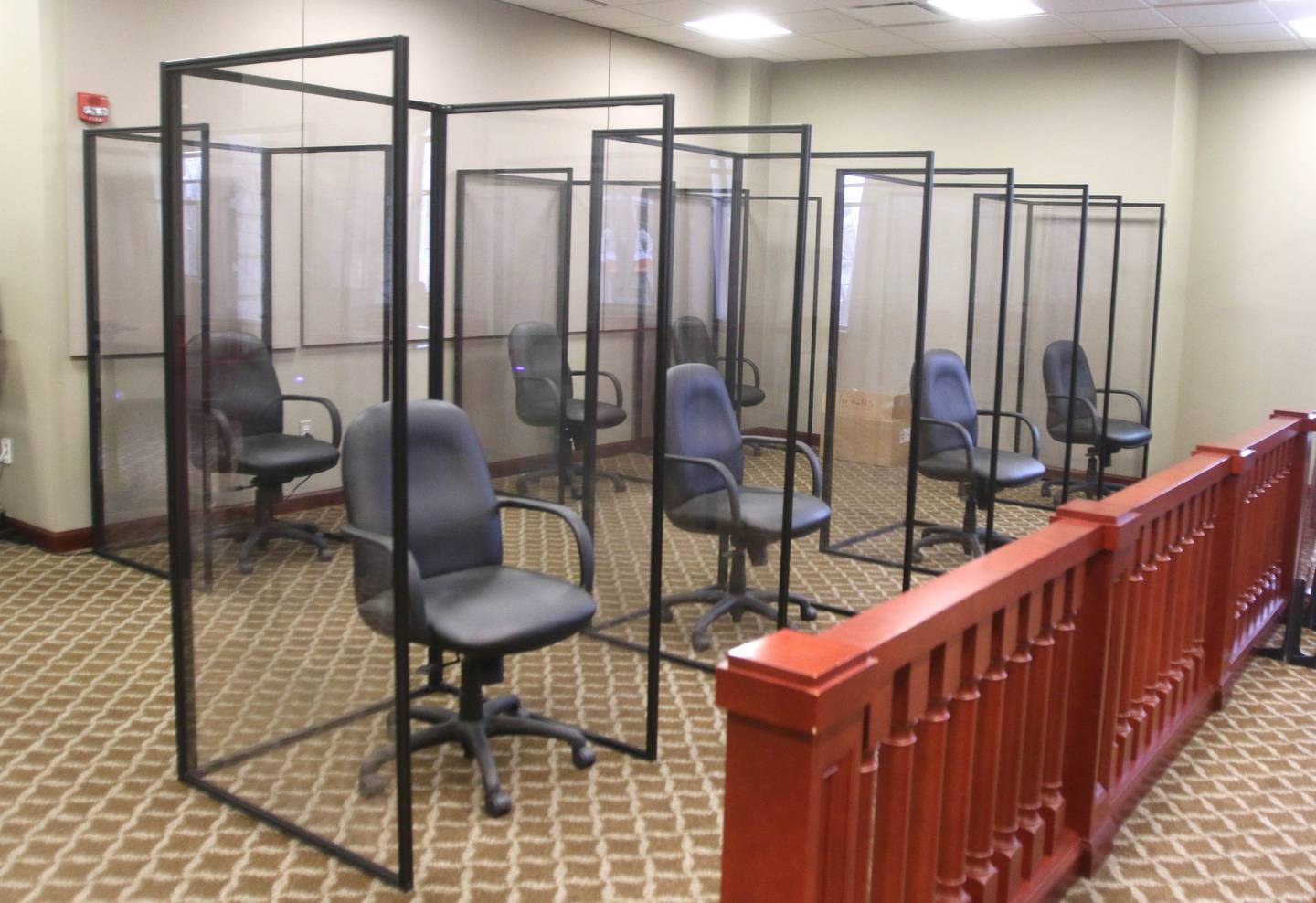 Part of the jury seating area in a courtroom at the DeKalb County Courthouse where each juror will be protected on three sides by plexiglass dividers. The new setup was created using the recommendations of the DeKalb County Health Department to prevent the spread of COVID-19 and includes multiple plexiglass dividers between court members and personal plexiglass booths for each juror.