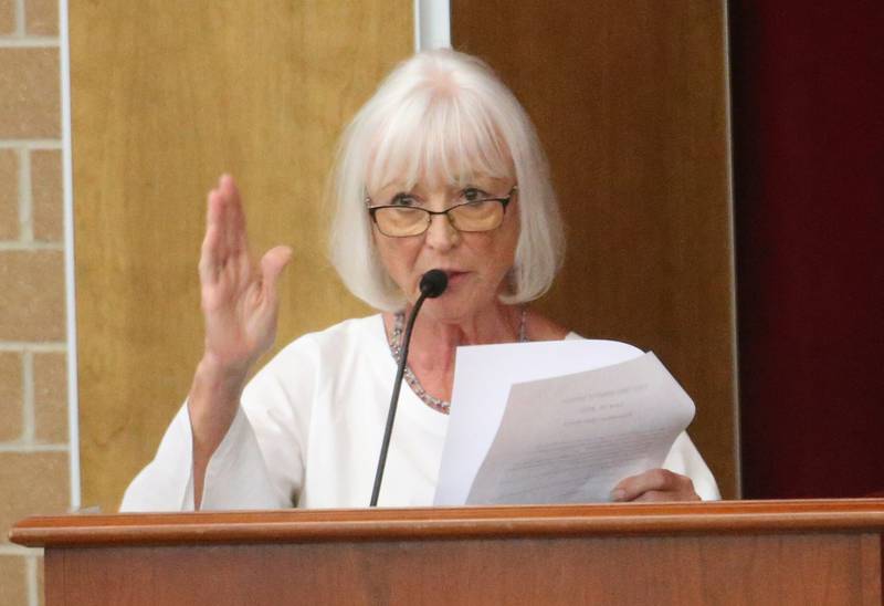 Geri Perry speaks to the Illinois Health Facilities and Services Review Board during a public hearing regarding OSF St. Elizabeth Hospital's plans to reduce services on Tuesday, June 10, at Central Intermediate School in Ottawa.