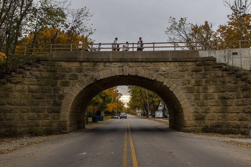 The Dixon boys cross country team crosses First Street on the multi-use path Thursday, Nov. 6, 2025. The team is gearing up for this weekend’s state tournament.
