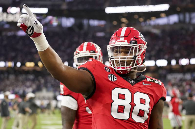 Georgia defensive lineman Jalen Carter waves to the crowd before the national championship game between Georgia and TCU, Monday, Jan. 9, 2023, in Inglewood, Calif.