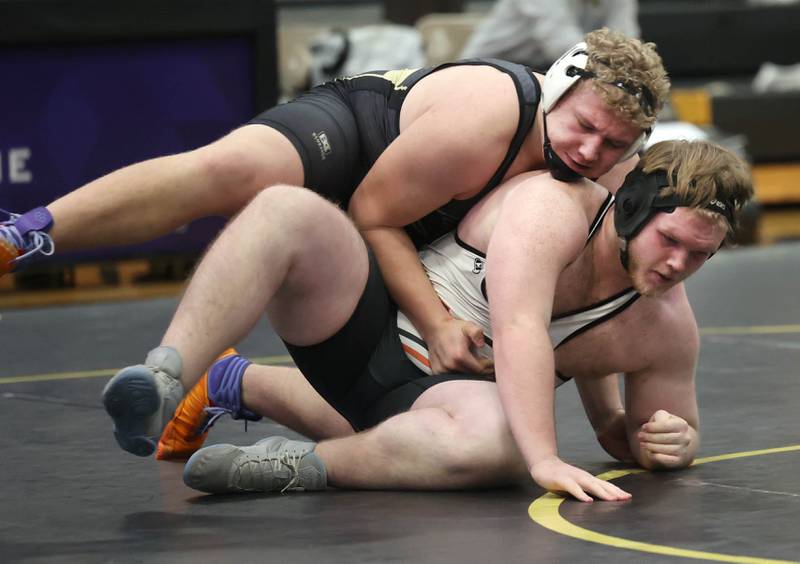 Sycamore’s Collin Hughes tries to turn Kaneland’s Levi Herst during their 285 pound match Thursday, Jan. 9, 2025, at Sycamore High School.