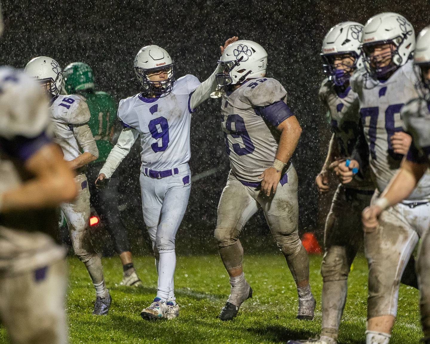 Evan Ostheim (9) of Wilmington celebrates with teammate Zach Ohlund (59) after team scores a touchdown on Saturday, November 8, 2025 at Seneca High School in Seneca.