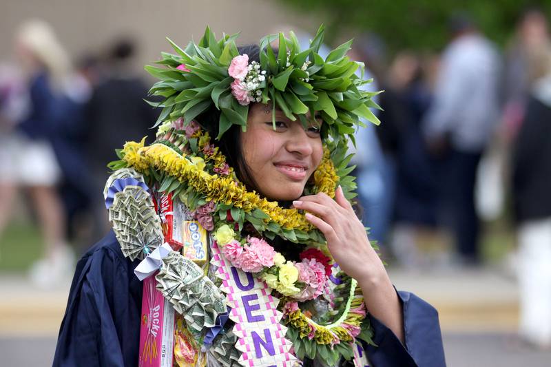 Uenikai Neitika Iaman dons Pacific Islander celebratory attire following graduation at Cary-Grove High School in Cary on Saturday, May 17, 2025.