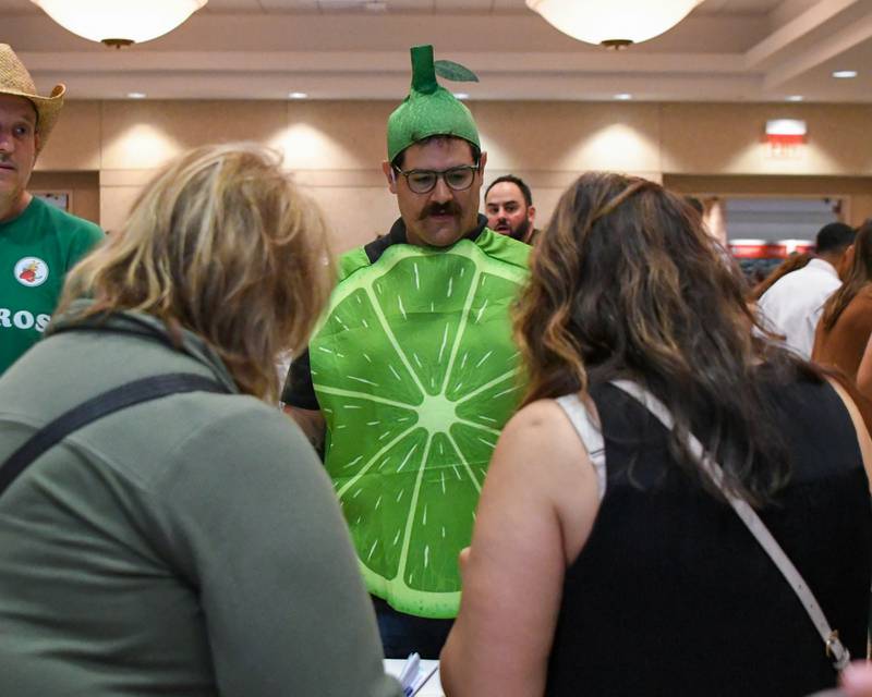 Nicholas Schwartz talks to participants about his Lip Pucker' n Pie dessert on Saturday, Aug. 9, 2025,  during the 21st annual CASA DeKalb County's Men Who Cook fundraiser held at Northern Illinois University's Barsema Alumni and Visitors Center.