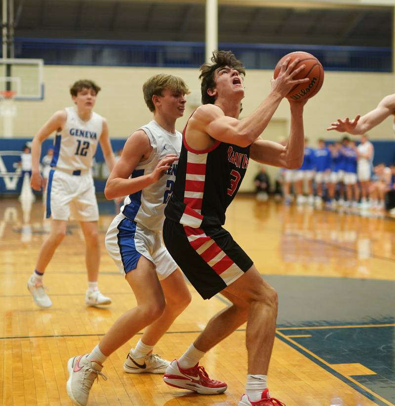 Batavia's Kyle Porter (3) play the ball in the post against Geneva’s Dane Turner (22) during a basketball game at Geneva High School on Friday, Dec 15, 2023.